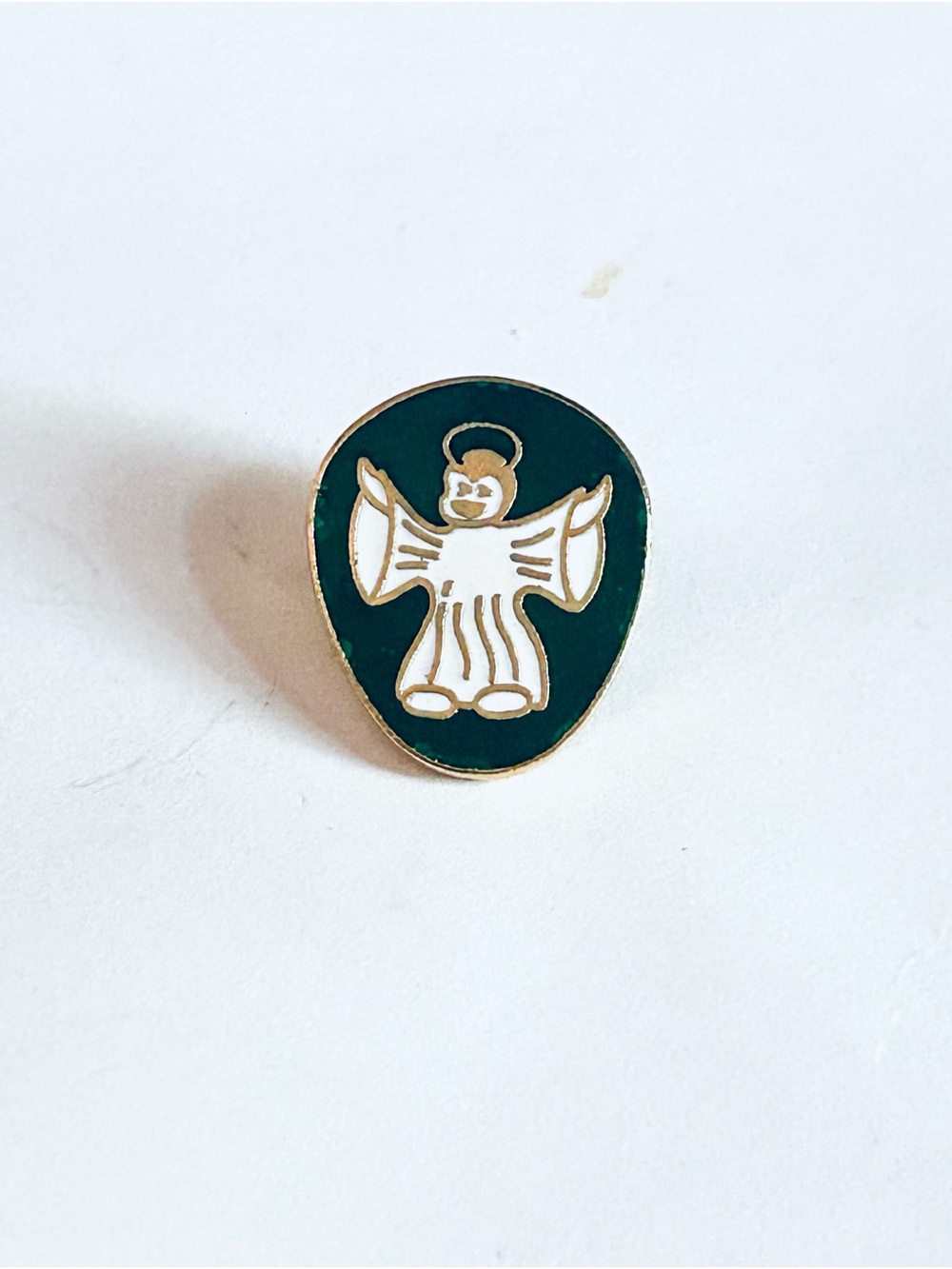 Gold-Trim White Angel Enamel Pin on Dark Green